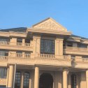 哈尔滨黄金麻别墅外墙干挂石材效果示例