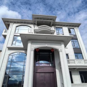 哈尔滨白麻别墅外墙干挂石材效果示例