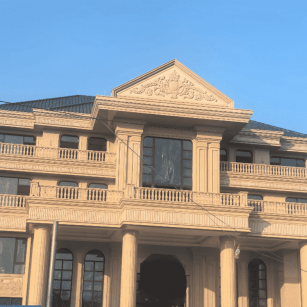 哈尔滨黄金麻别墅外墙干挂石材效果示例