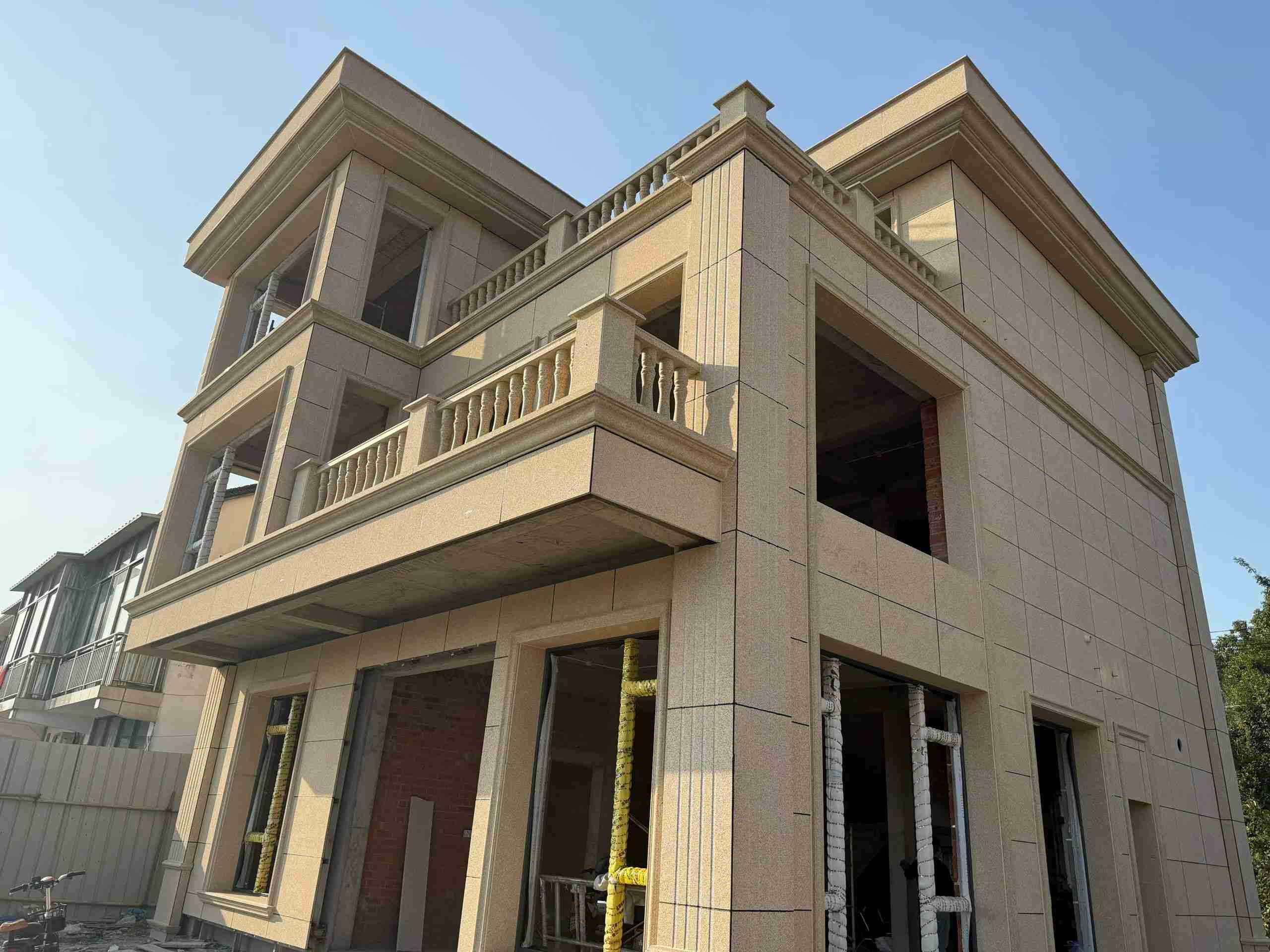 哈尔滨 黄金麻花岗岩石材荔枝面外墙干挂效果展示